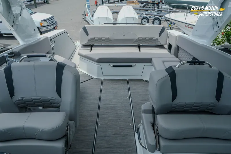 Slide: The Image of 2026 Four Winns H9 OB boat interior with gray seating and modern design. - 23