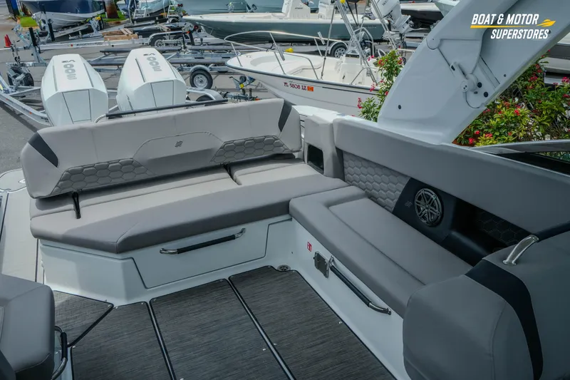 Slide: The Image of 2026 Four Winns H9 OB boat interior with gray seating and modern design. - 24
