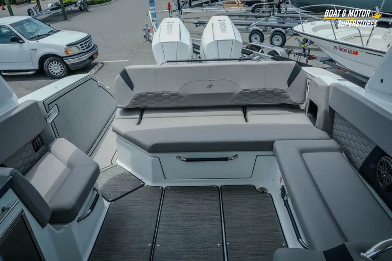 Slide: The Image of 2026 Four Winns H9 OB boat interior with gray seating and modern design. - 25