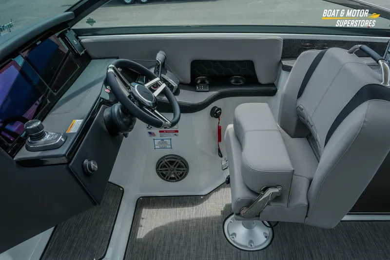 Slide: The Image of 2026 Four Winns H9 OB boat cockpit with modern steering and dual seating. - 27