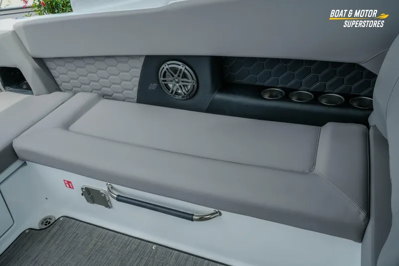 Slide: The Image of Interior seating of 2026 Four Winns H9 OB boat with cup holders and speaker. - 32