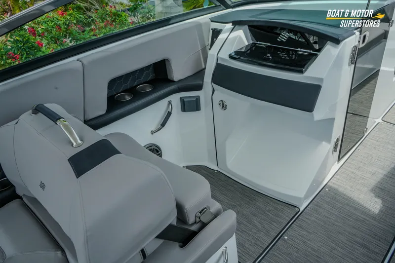 Slide: The Image of Interior of 2026 Four Winns H9 OB boat with sleek seating and modern design. - 33