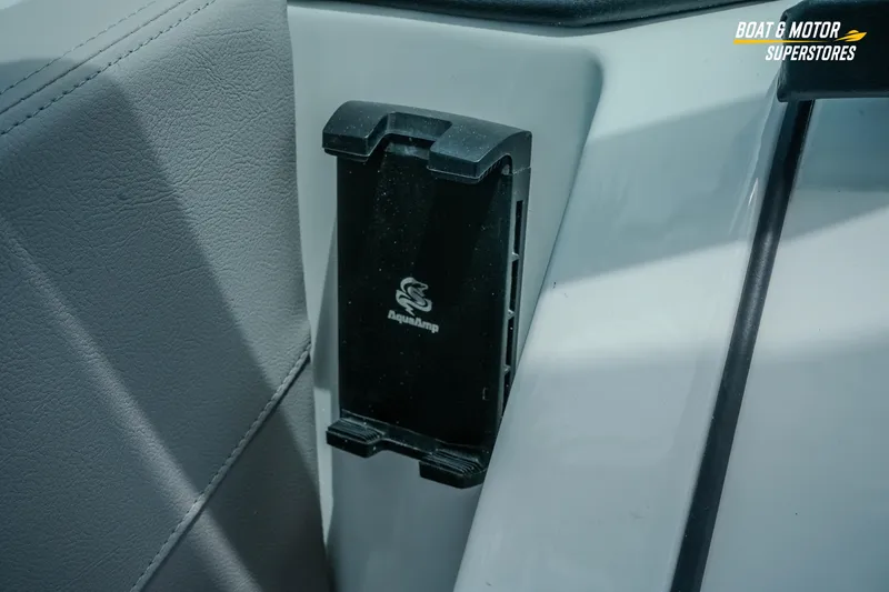 Slide: The Image of Interior detail of 2026 Four Winns H9 OB boat with AquaAmp device holder. - 35