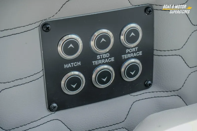 Slide: The Image of Control panel on 2026 Four Winns H9 OB boat, featuring hatch and terrace buttons. - 37