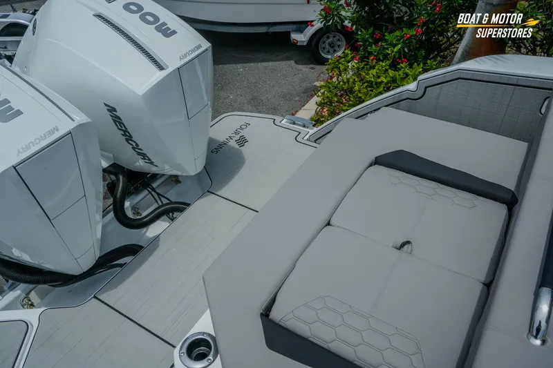 Slide: The Image of 2026 Four Winns H9 OB boat with dual Mercury outboard engines and sleek seating area. - 40