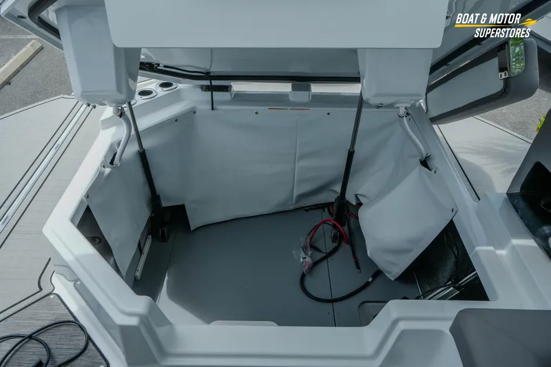 Slide: The Image of Open storage compartment of 2026 Four Winns H9 OB boat, showcasing interior space. - 6