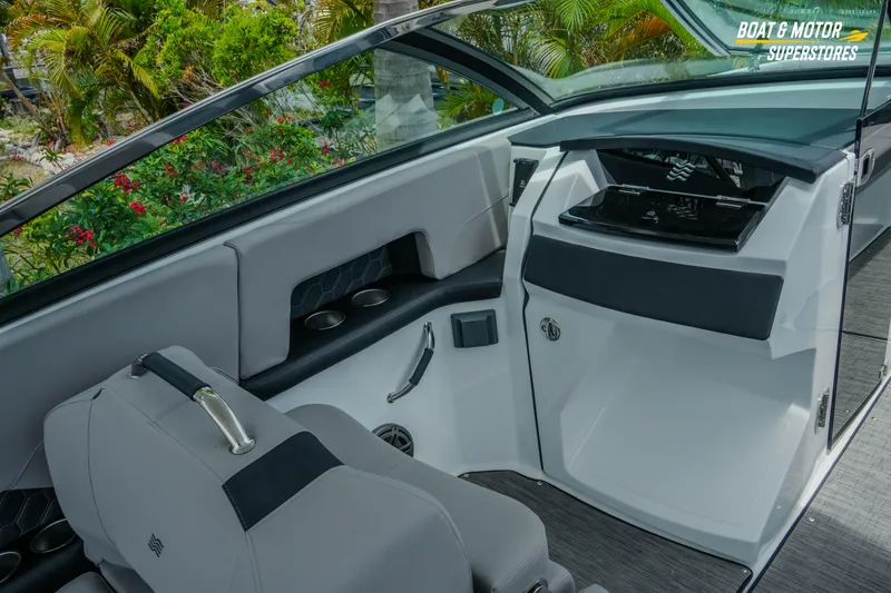 Slide: The Image of 2026 Four Winns H9 OB boat interior with sleek seating and modern dashboard design. - 9