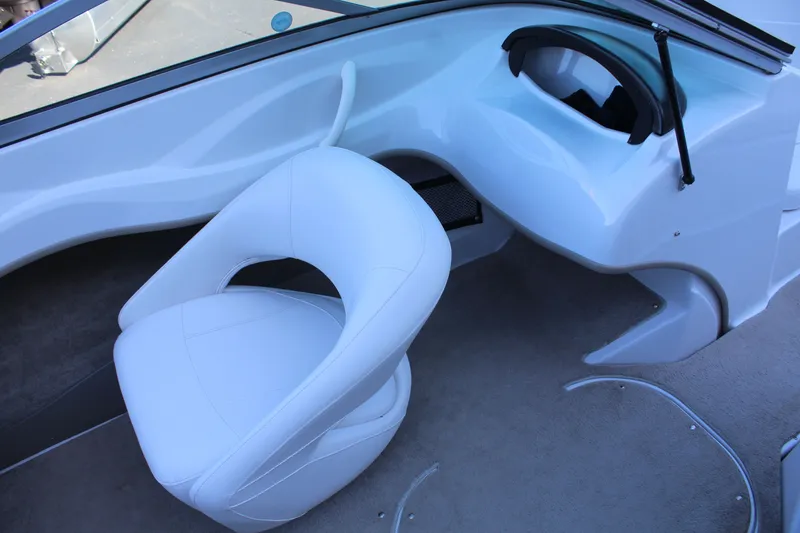 Slide: The Image of Interior of a 2011 Four Winns H180 LE boat with white seating. - 11
