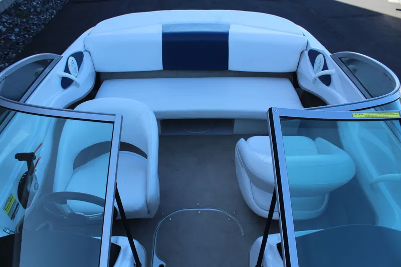 Slide: The Image of Interior of a 2011 Four Winns H180 LE boat with white seating. - 13