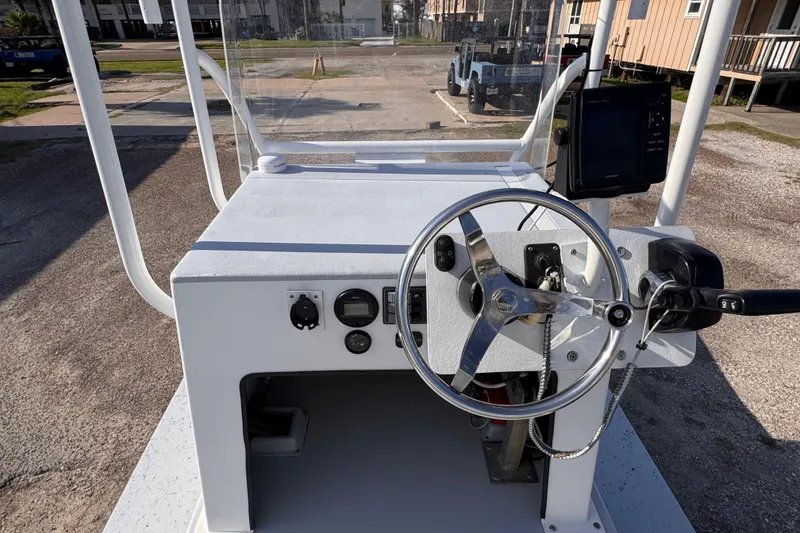 Slide: The Image of Steering console of a 2006 Waterman K-18 boat with navigation equipment. - 11