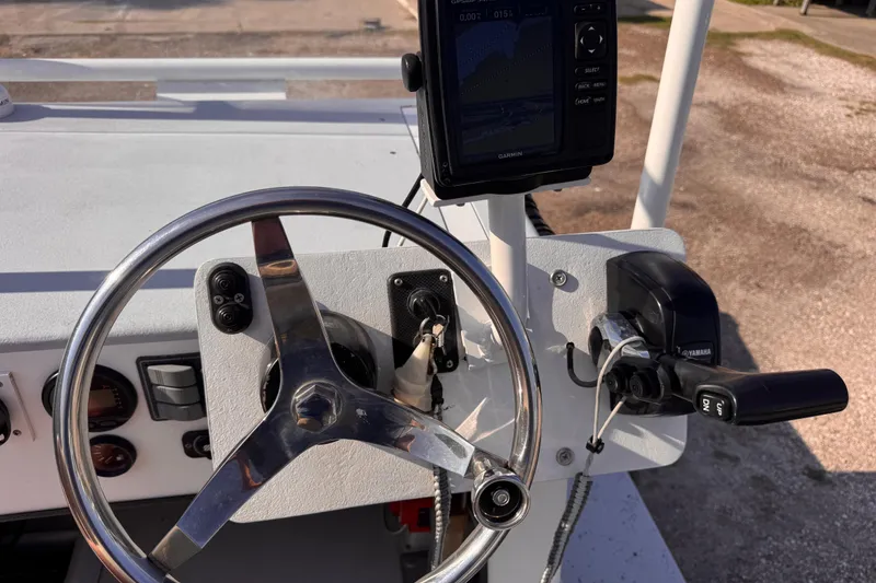 Slide: The Image of Boat steering console with Garmin GPS, Yamaha throttle, and Waterman K-18 controls, 2006 model. - 13