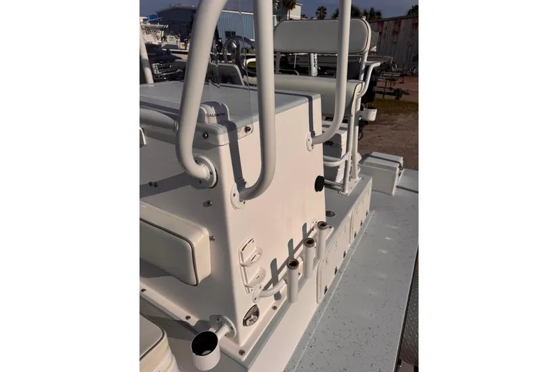 Slide: The Image of Waterman K-18 boat console, 2006 model, featuring rod holders and seating. - 24