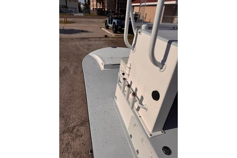 Slide: The Image of Waterman K-18 boat deck, 2006 model, featuring rod holders and storage compartments. - 25