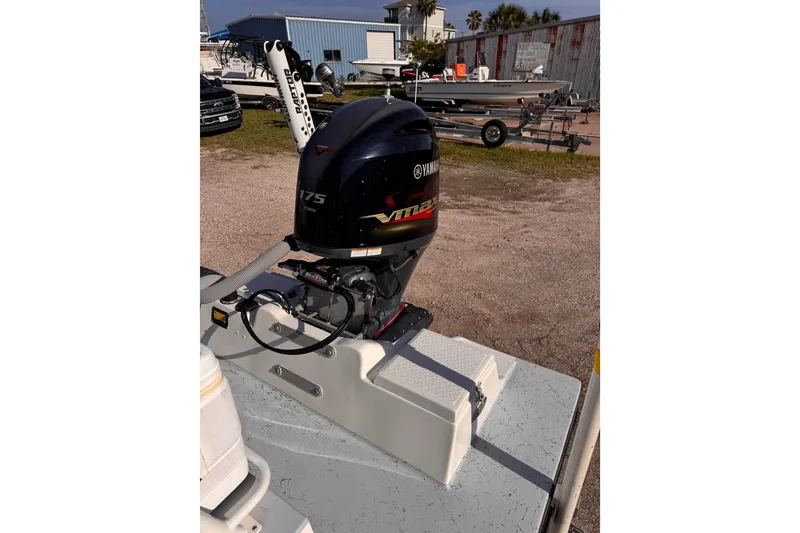Slide: The Image of Boat with Yamaha 175 VMAX outboard motor, Waterman K-18, 2006 model, in a marina setting. - 27