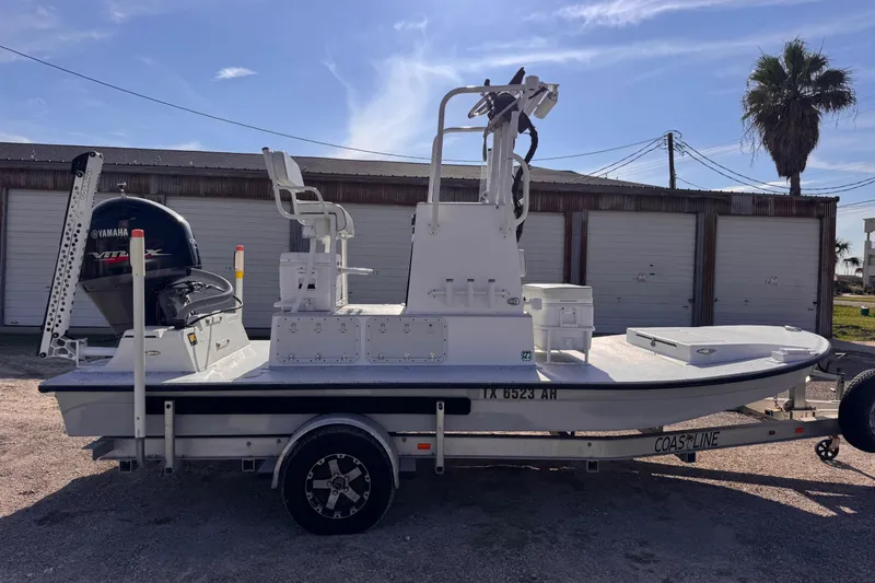 Slide: The Image of 2006 Waterman K-18 boat with Yamaha engine on trailer, parked outdoors. - 3