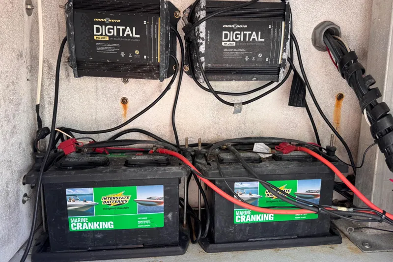 Slide: The Image of Marine battery setup with Interstate Batteries and Minn Kota chargers, Waterman K-18, 2006 model. - 31
