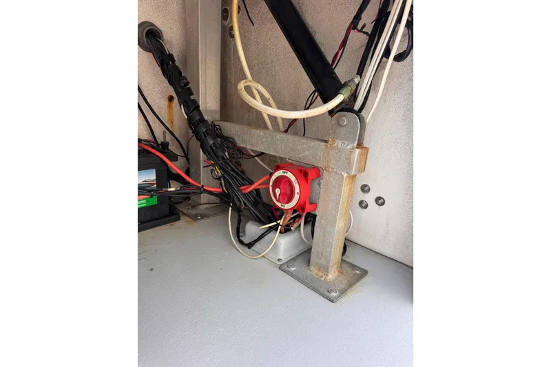 Slide: The Image of Electrical setup inside a Waterman K-18 (2006) with wiring and a red switch. - 33