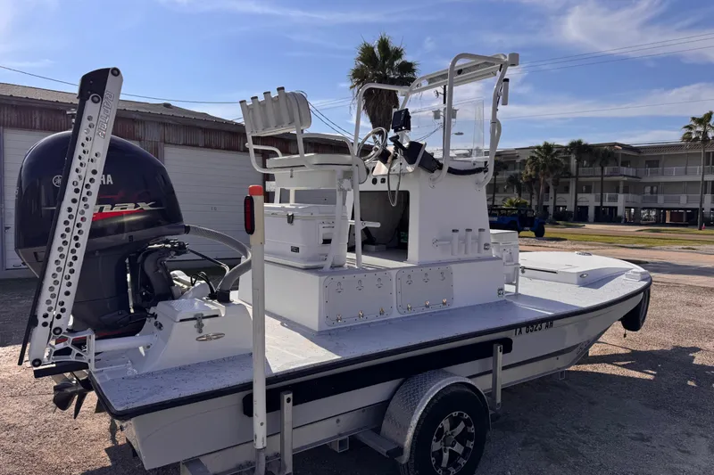 Slide: The Image of 2006 Waterman K-18 boat with Yamaha engine on trailer, parked outdoors. - 4