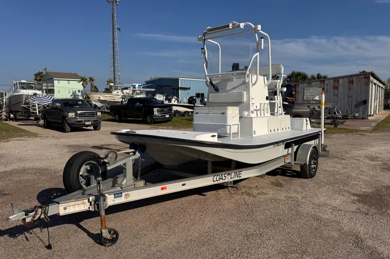 Slide: The Image of 2006 Waterman K-18 boat on trailer in a marina parking lot. - 5