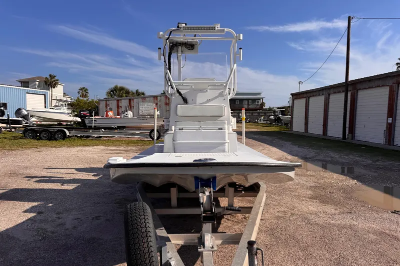Slide: The Image of 2006 Waterman K-18 boat on trailer in outdoor storage area. - 6