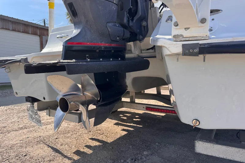 Slide: The Image of Rear view of a 2006 Waterman K-18 boat with a visible propeller. - 8
