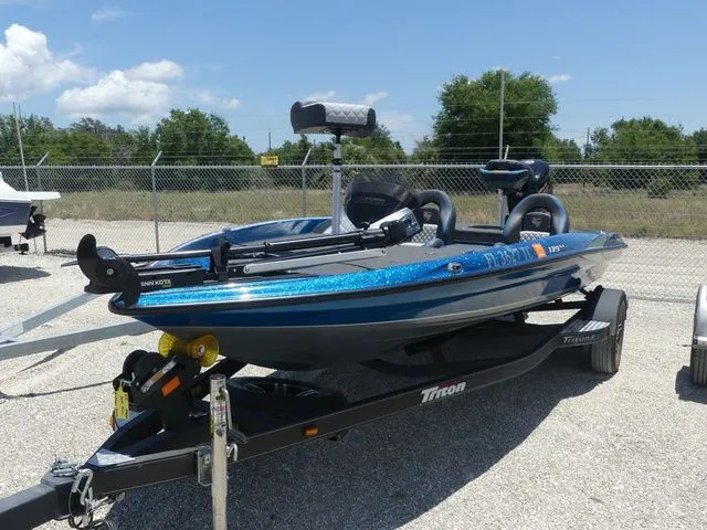 The Image of 2022 Triton 179 TrX boat on trailer outdoors. - 1