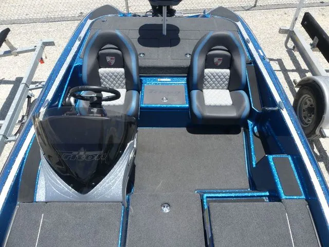 Slide: The Image of Interior of a blue 2022 Triton 179 TrX boat with two seats. - 13