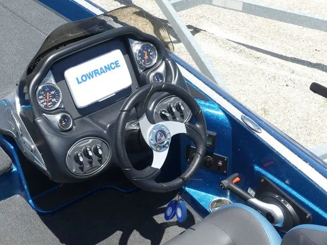 Slide: The Image of 2022 Triton 179 TrX boat cockpit with Lowrance display. - 15