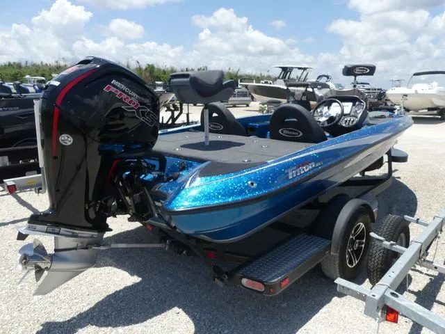 Slide: The Image of 2022 Triton 179 TrX boat with outboard motor on trailer. - 4