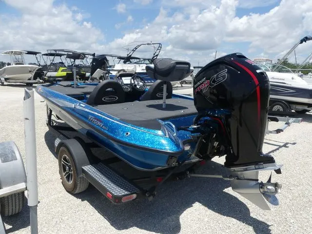 Slide: The Image of 2022 Triton 179 TrX boat on trailer outdoors. - 6
