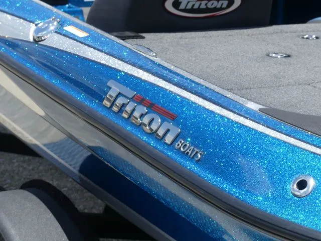 Slide: The Image of 2022 Triton 179 TrX boat in sparkling blue. - 7