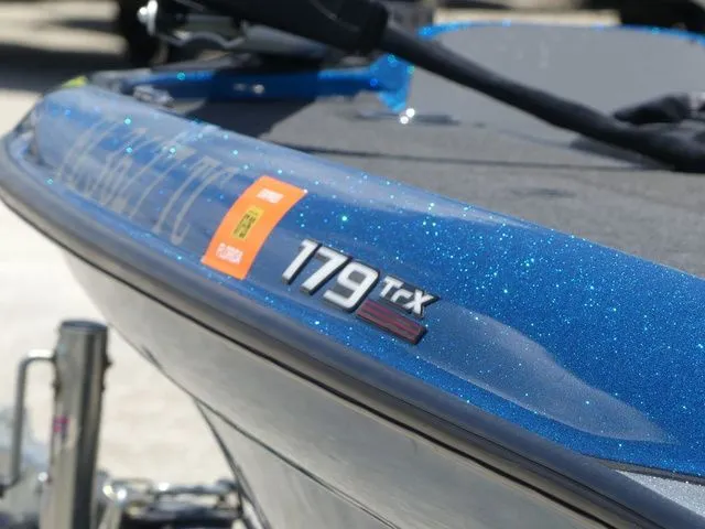 Slide: The Image of Close-up of a blue 2022 Triton 179 TrX boat. - 8