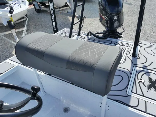 Slide: The Image of 2026 Xpress Skiff 185 with gray seat and motor. - 10
