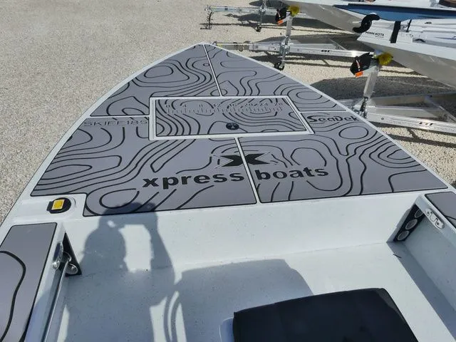 Slide: The Image of 2026 Xpress Skiff 185 boat with modern deck design. - 11