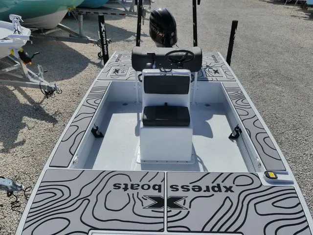 Slide: The Image of 2026 Xpress Skiff 185 boat with modern design. - 13