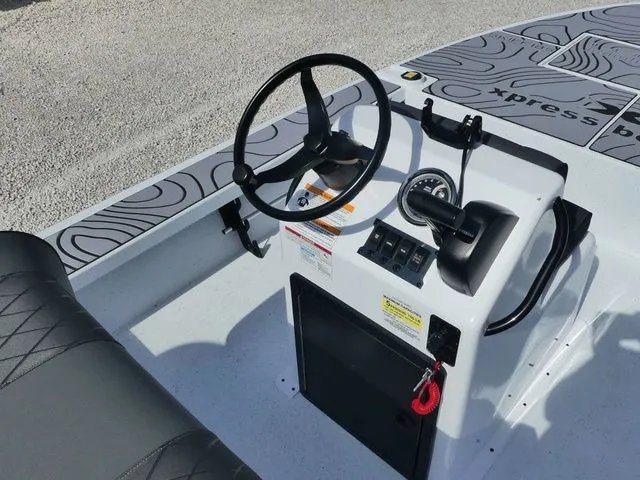 Slide: The Image of Interior view of 2026 Xpress Skiff 185 boat. - 7