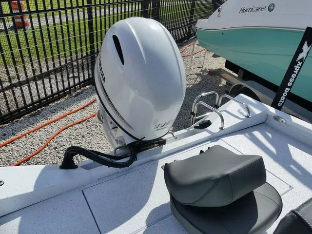 Slide: The Image of 2026 Xpress HYPER-LIFT H20 BAY with Yamaha engine, parked on boat trailer. - 4