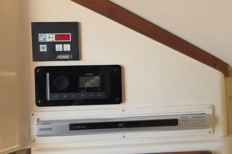 Slide: The Image of Control panel and audio system in 2007 Grady-White Express 305 boat interior. - 19