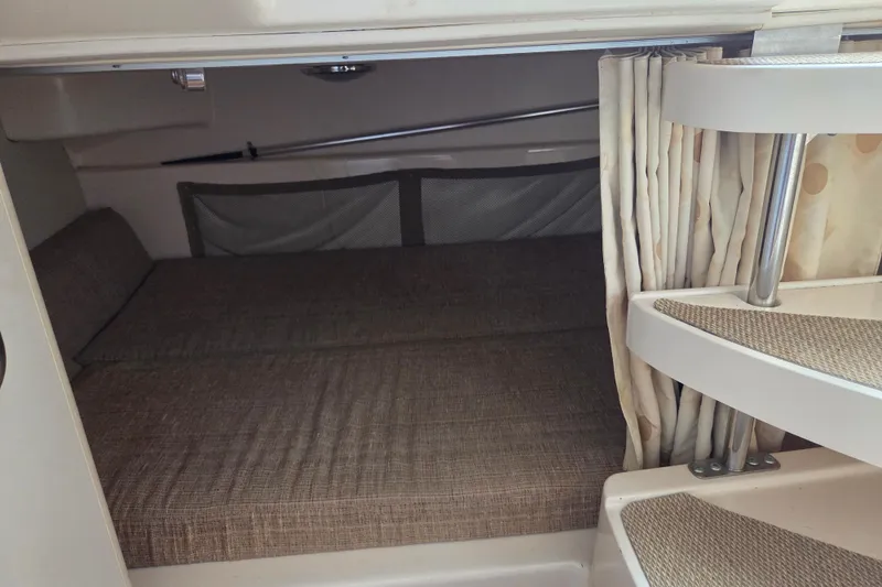 Slide: The Image of 2007 Grady-White Express 305 cabin interior with cozy sleeping area and steps. - 20