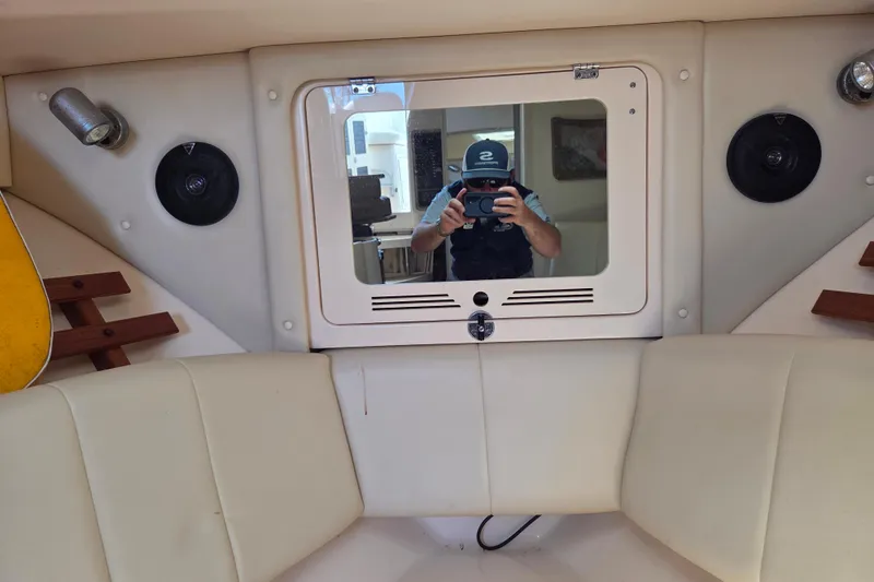 Slide: The Image of Interior of 2007 Grady-White Express 305 boat with mirror and seating. - 23