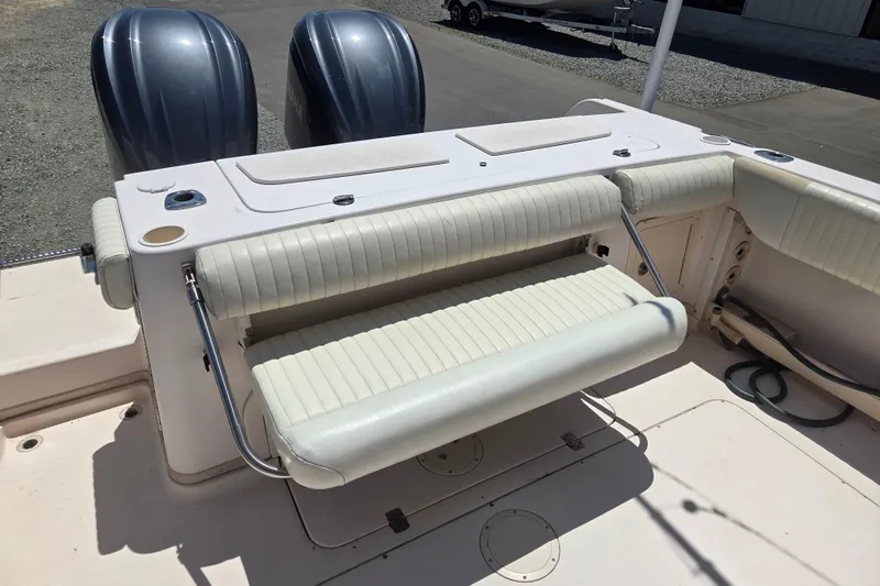 Slide: The Image of 2007 Grady-White Express 305 boat with foldable seating and dual outboard engines. - 9