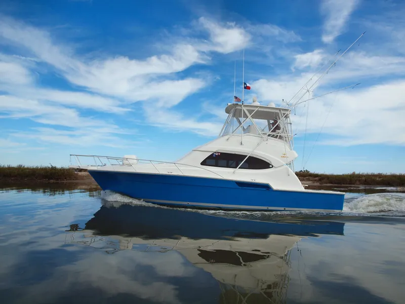 The Image of 2004 Bertram 390 Convertible yacht on calm waters. - 0