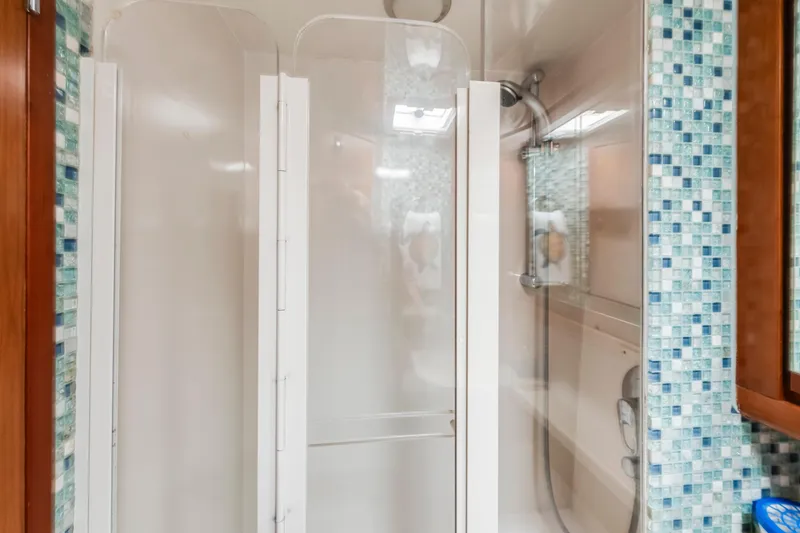 Slide: The Image of Shower area in 2004 Bertram 390 Convertible yacht with mosaic tile accents. - 23