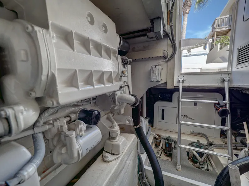 Slide: The Image of Engine room of a 2004 Bertram 390 Convertible, showcasing technical details. - 24