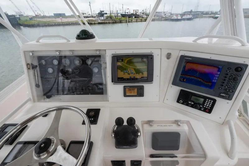 Slide: The Image of Control panel of a 2004 Bertram 390 Convertible boat with navigation equipment. - 4