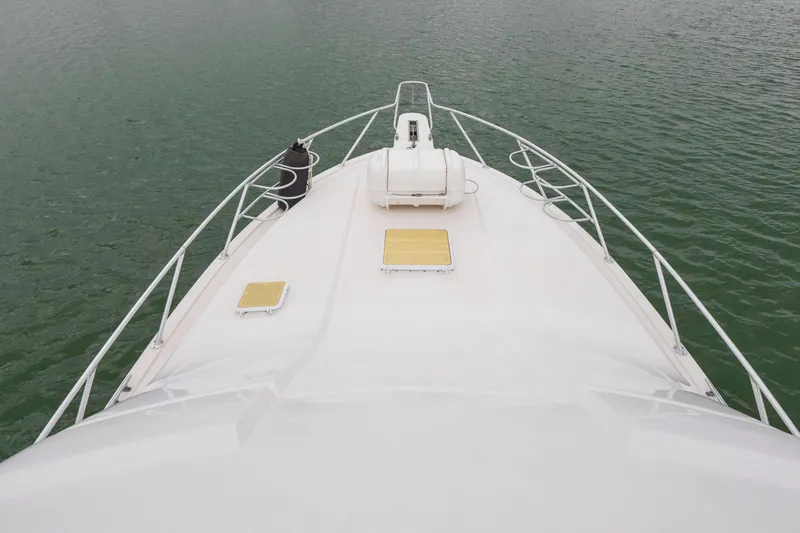 Slide: The Image of Bow view of 2004 Bertram 390 Convertible yacht on calm water. - 7