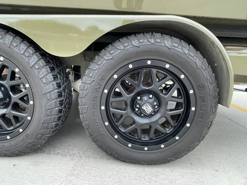 Slide: The Image of Close-up of 2024 Tigé 24RZX boat trailer tires. - 12