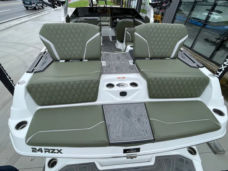 Slide: The Image of 2024 Tigé 24RZX boat with luxurious seating and modern design. - 13