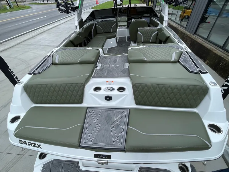 Slide: The Image of Interior of 2024 Tigé 24RZX boat with green upholstery. - 17