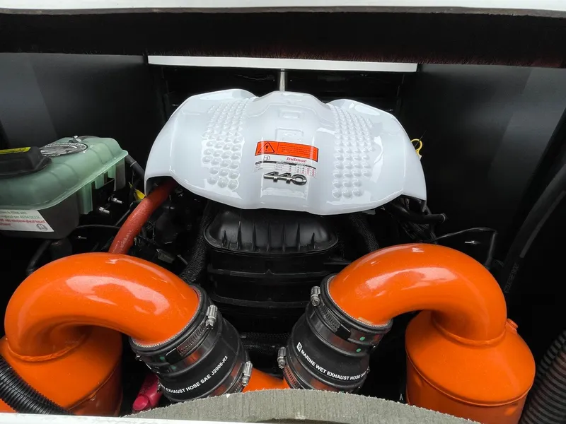 Slide: The Image of Engine compartment of 2024 Tigé 24RZX with orange hoses. - 18